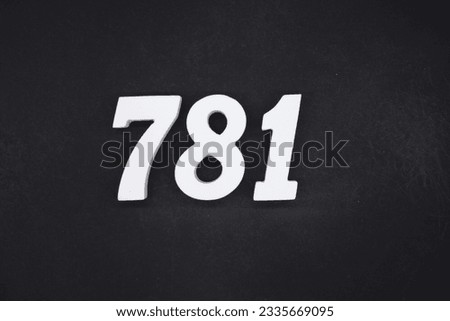 Black for the background. The number 781 is made of white painted wood.