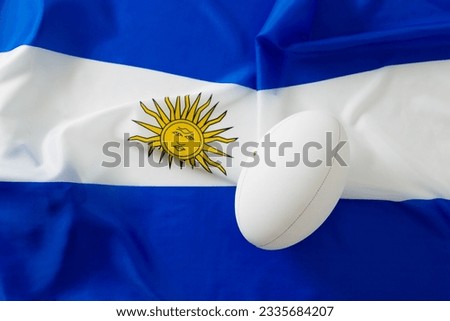 White rugby ball over flag of argentina. Rugby, sport, international, competition and games digitally generated image.