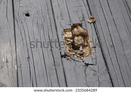 Damaged and Split Wooden Deck Planks Royalty-Free Stock Photo #2335684289