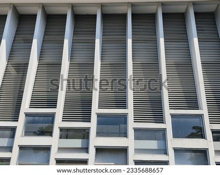 The facade of a mosque building with a minimalist concept with accent lines.