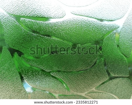The Glass texture with green floral background of indian monsoon. 