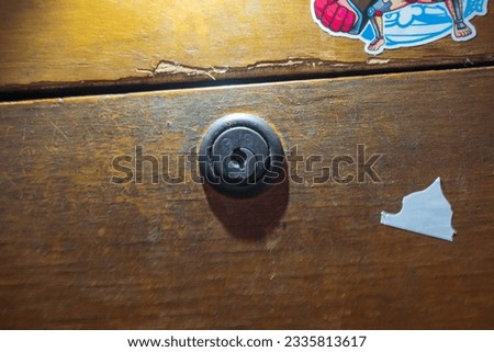 desk drawer with its rusty lock housing Royalty-Free Stock Photo #2335813617