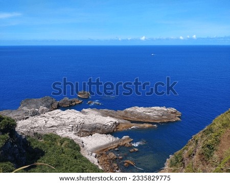 The view of the Bitou Cape with cliff and  wave-cut platform on the coast in New Taipei City in Taiwan Royalty-Free Stock Photo #2335829775