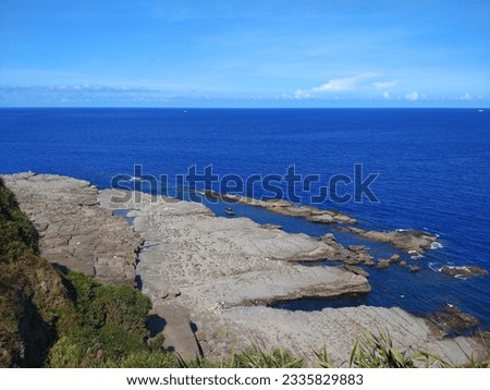 The view of the Bitou Cape with cliff and  wave-cut platform on the coast in New Taipei City in Taiwan Royalty-Free Stock Photo #2335829883