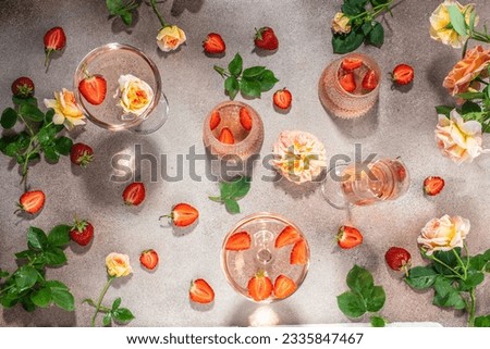 rose wine and strawberries, top view. celebrating background Royalty-Free Stock Photo #2335847467