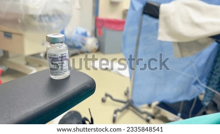 Symbolic hospital meds, Narcotic syringe, needle, morphine, fentanyl, IV drip, meds represent healing, pain relief, and healthcare in a clinical setting