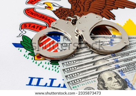 Handcuffs with cash money and Illinois state flag. Cash bail reform, bail bond and cashless bail concept. Royalty-Free Stock Photo #2335873473