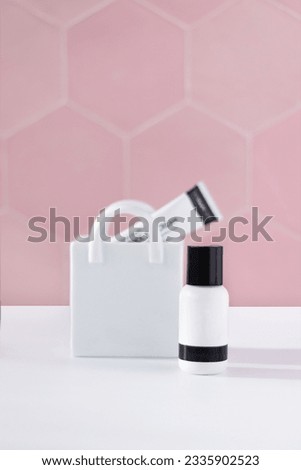 Colorful bottle on white background. Facial skin care, moisturizer concept. Fashionable and Elegant cosmetic product with a vase. Minimalist photography. Creative Skincare product photography.