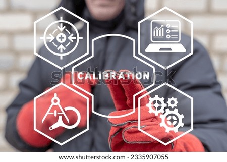 Engineer using virtual touch screen presses word: CALIBRATION. Concept of activate calibration, intermediate check or calibration measurement. Industrial calibration operations. Royalty-Free Stock Photo #2335907055