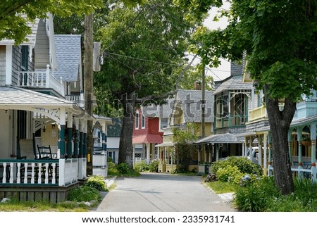 Beautiful colorful gingerbread houses, cottages in Oak Bluffs center, Martha's Vineyard island in Massachusetts USA on a sunny summer day Royalty-Free Stock Photo #2335931741
