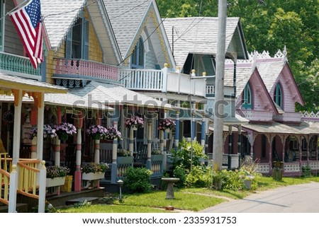 Beautiful colorful gingerbread houses, cottages in Oak Bluffs center, Martha's Vineyard island in Massachusetts USA on a sunny summer day Royalty-Free Stock Photo #2335931753