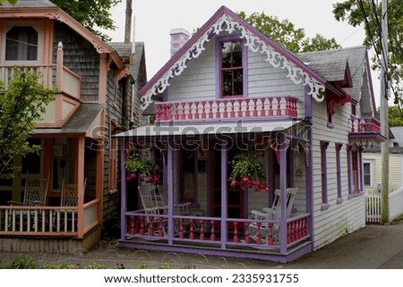 Beautiful colorful gingerbread houses, cottages in Oak Bluffs center, Martha's Vineyard island in Massachusetts USA on a sunny summer day Royalty-Free Stock Photo #2335931755