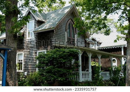 Beautiful colorful gingerbread houses, cottages in Oak Bluffs center, Martha's Vineyard island in Massachusetts USA on a sunny summer day Royalty-Free Stock Photo #2335931757