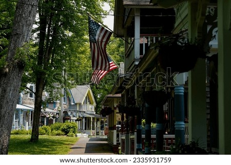 Beautiful colorful gingerbread houses, cottages in Oak Bluffs center, Martha's Vineyard island in Massachusetts USA on a sunny summer day Royalty-Free Stock Photo #2335931759