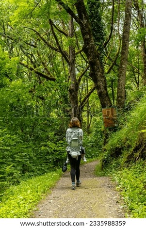 A female hiker on a mountain trail in the Borce commune of the French Pyrenees