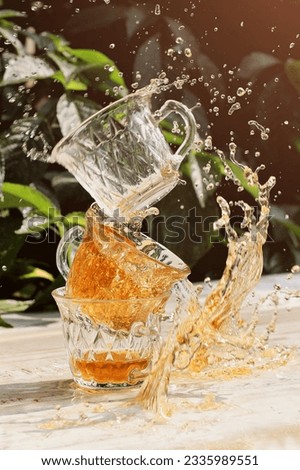 still life photography, water splash of cup of tea