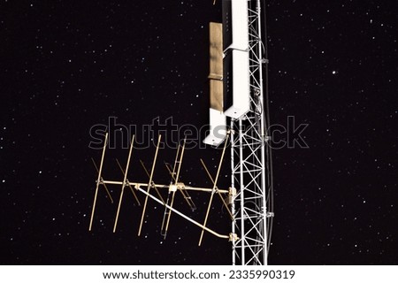 A Radio Tower Set against the Starry Night
