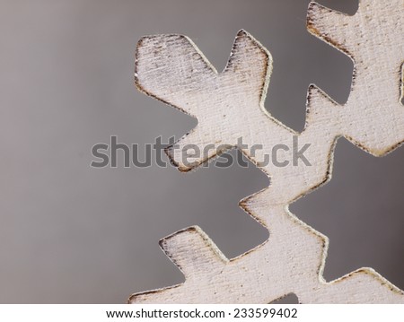 Large snowflake closely. Wooden Christmas ornament in the shape of a snowflake.