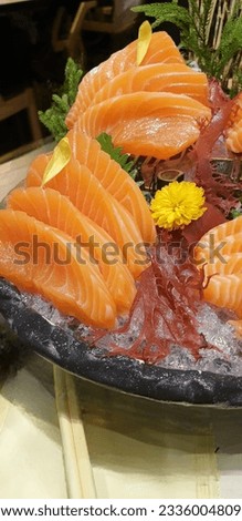 Salmon Sashimi with fresh wasabi adding red seawood and green shi so Royalty-Free Stock Photo #2336004809