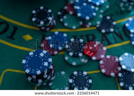 Poker chips on bokeh background. Casino theme.