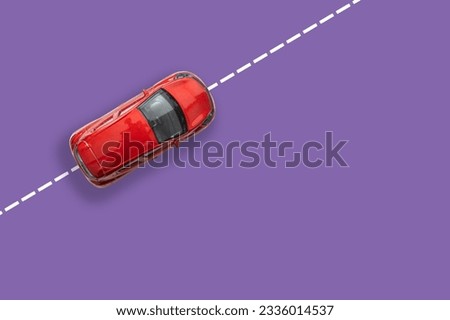  abstract white car rides on the road with markings. purple or lilac background. top view. copy space