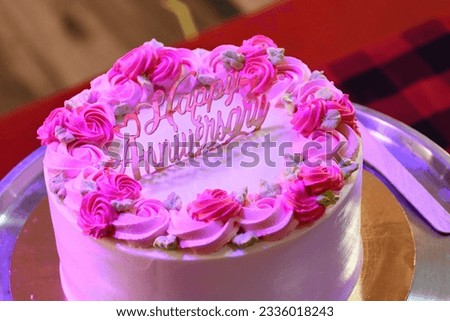 Carrot cake with pink glaze, beautiful flowers and edible silver as a decoration. Pink cake. for anniversary