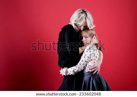 Lovely portrait of mother with daughter. Closeup photo.