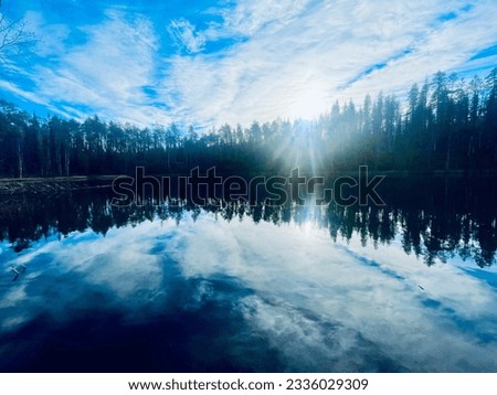 Lake's beauty reflected - captivating waters mirror nature's enchanting charm.