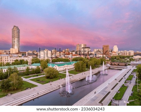 Embankment of the central pond and musical fountain. The historic center of the city of Yekaterinburg, Russia, Sunset in the summer or spring. Aerial View