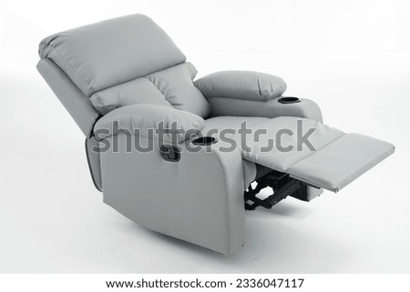 Grey reclining chair isolated on white background with clipping path, grey leather recliner armchair with massage and foot rest in reclined position, isolated on white, reclining chair isolated,  Royalty-Free Stock Photo #2336047117
