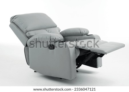 Grey reclining chair isolated on white background with clipping path, grey leather recliner armchair with massage and foot rest in reclined position, isolated on white, reclining chair isolated,  Royalty-Free Stock Photo #2336047121