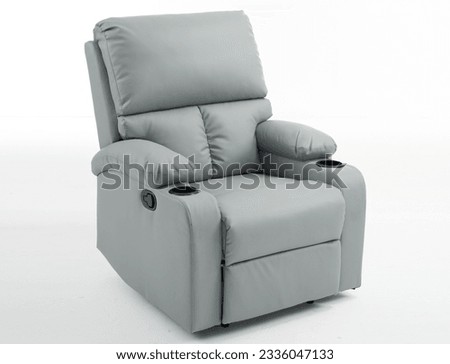 Grey reclining chair isolated on white background with clipping path, grey leather recliner armchair with massage and foot rest in reclined position, isolated on white, reclining chair isolated,  Royalty-Free Stock Photo #2336047133