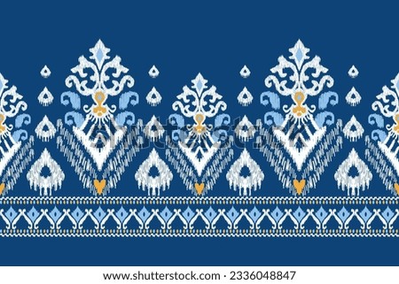Ikat floral paisley embroidery on blue background.Ikat ethnic oriental pattern traditional.Aztec style abstract vector illustration.design for texture,fabric,clothing,wrapping,decoration,sarong,scarf.