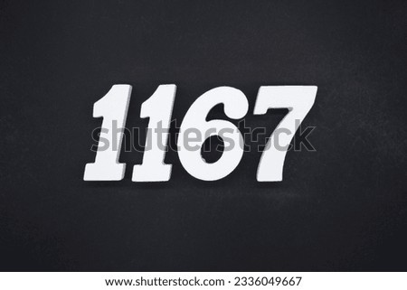 Black for the background. The number 1167 is made of white painted wood.