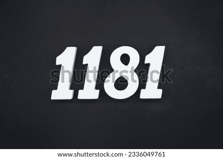Black for the background. The number 1181 is made of white painted wood.