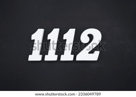 Black for the background. The number 1112 is made of white painted wood.