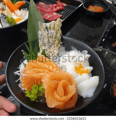 Salmon Sashimi with fresh wasabi adding red seawood and green shi so Royalty-Free Stock Photo #2336053621