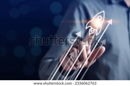 Businessman touch rocket launch investment growth, planning and starting corporate business start up aiming objective value development leadership and customer target group. Royalty-Free Stock Photo #2336062763