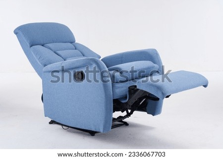 Blue recliner chair, reclining chair isolated on white background, Comfortable Modern Recliner Sofa on Minimalist and Modern Home, Light blue contemporary recliner armchair with plaid Royalty-Free Stock Photo #2336067703