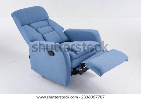 Blue recliner chair, reclining chair isolated on white background, Comfortable Modern Recliner Sofa on Minimalist and Modern Home, Light blue contemporary recliner armchair with plaid Royalty-Free Stock Photo #2336067707