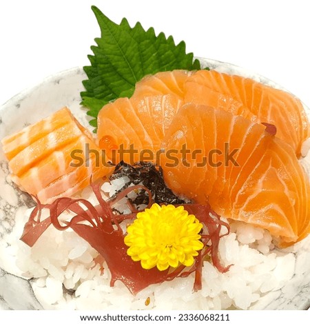 Salmon Sashimi set with fresh wasabi adding red seawood and green shi so and yellow flower Royalty-Free Stock Photo #2336068211