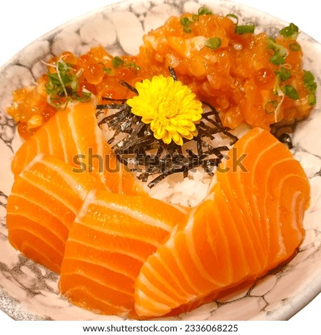 Salmon Sashimi set with fresh wasabi adding red seawood and green shi so and yellow flower Royalty-Free Stock Photo #2336068225