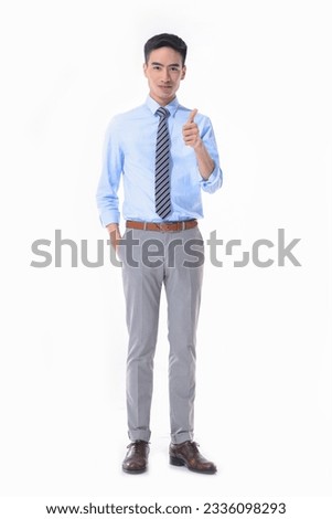 Full body young businessman  in blue shirt ,pants with tie with  thumb up posing on white background
