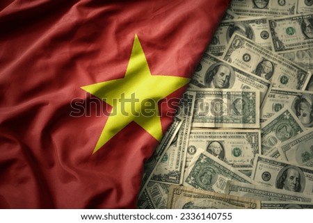 big colorful waving national flag of vietnam on a american dollar money background. finance concept