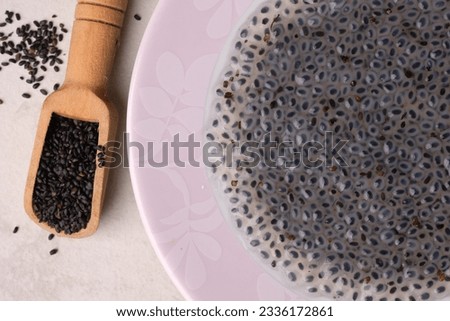 Ocimum is a genus of aromatic annual and perennial herbs and shrubs in the family Lamiaceae. Basil seeds in a wooden spoon. Selasih.
 Royalty-Free Stock Photo #2336172861