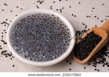 Ocimum is a genus of aromatic annual and perennial herbs and shrubs in the family Lamiaceae. Basil seeds in a wooden spoon. Selasih.
 Royalty-Free Stock Photo #2336172863