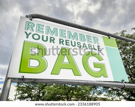 remember your reusable bag - sign in a parking lot of a grocery store