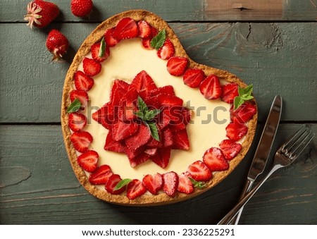 Baked Strawberry cheesecake New York with mint. Heart form. Homemade dessert top view Royalty-Free Stock Photo #2336225291