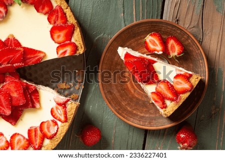 Baked Strawberry cheesecake New York with mint. Heart form. Homemade dessert top view Royalty-Free Stock Photo #2336227401