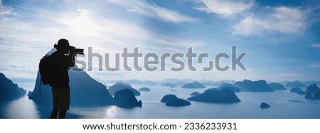 Men travel photography on the Mountain. Tourist on summer holiday vacation. Landscape Beautiful Mountain on sea at Samet Nangshe Viewpoint. Phang Nga Bay, Travel Thailand, Travel adventure nature.